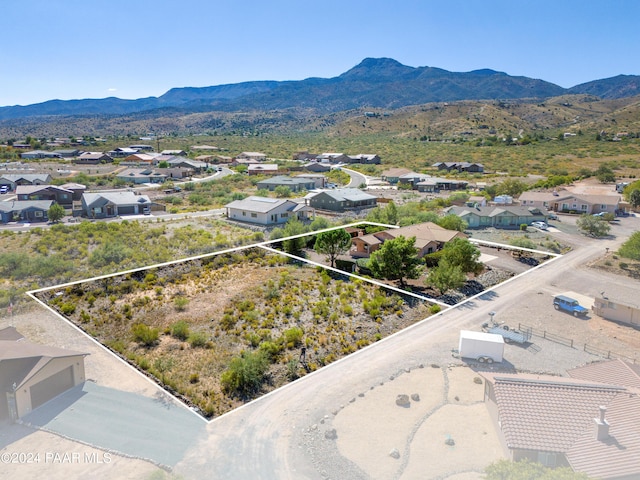 birds eye view of property with a mountain view