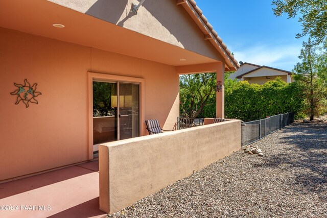 view of patio with a mountain view, a pergola, and a hot tub