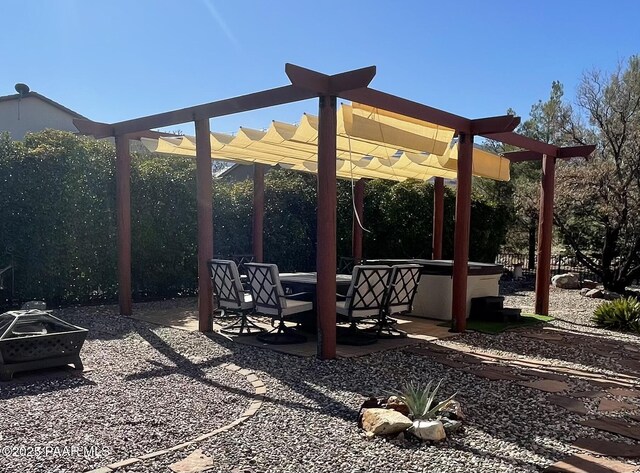 view of patio featuring a pergola and a hot tub