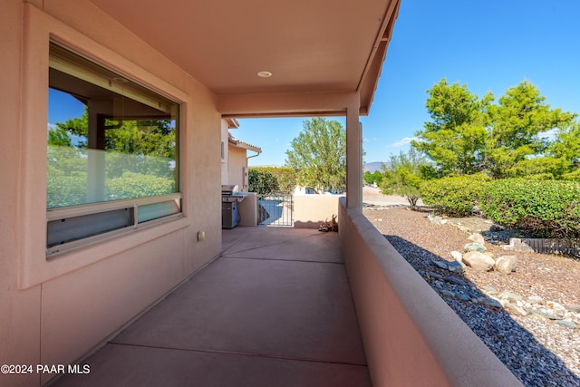 view of patio featuring a balcony and grilling area