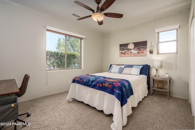 bedroom with multiple windows, carpet flooring, and ceiling fan