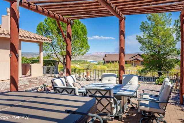 view of patio / terrace featuring a mountain view and a pergola