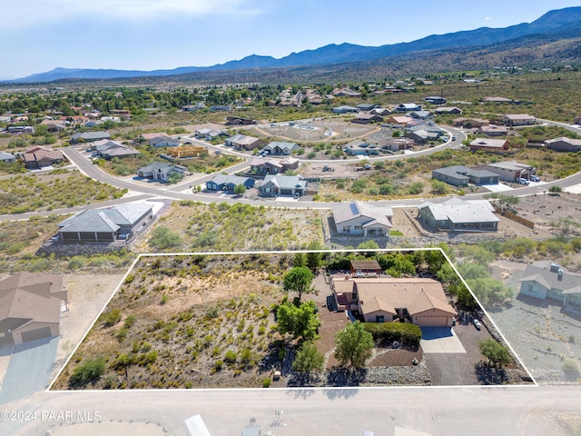 birds eye view of property with a mountain view