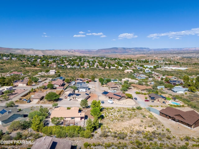 birds eye view of property with a mountain view