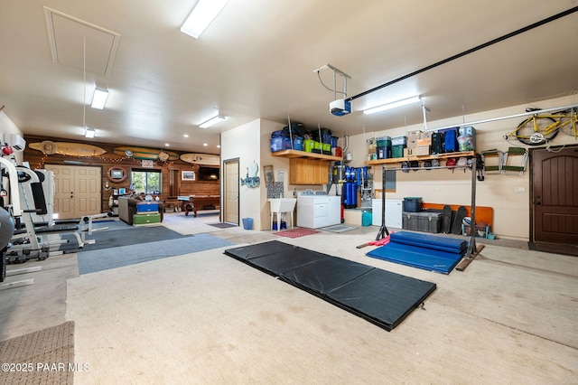 1501 W Kelly Dr, Prescott, AZ 86305 - garage featuring a garage door opener and washer and clothes dryer