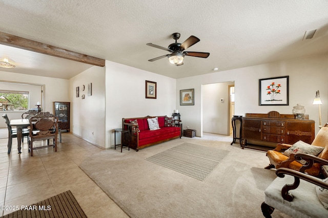 1501 W Kelly Dr, Prescott, AZ 86305 - living room with ceiling fan, a textured ceiling, light tile patterned floors, and beamed ceiling