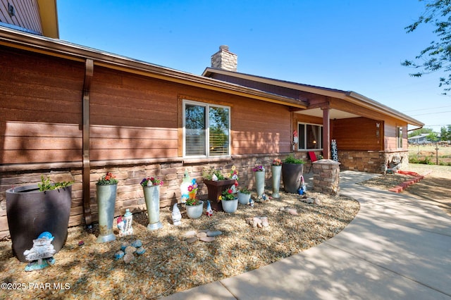 1501 W Kelly Dr, Prescott, AZ 86305 - view of front of house with a chimney and stone siding