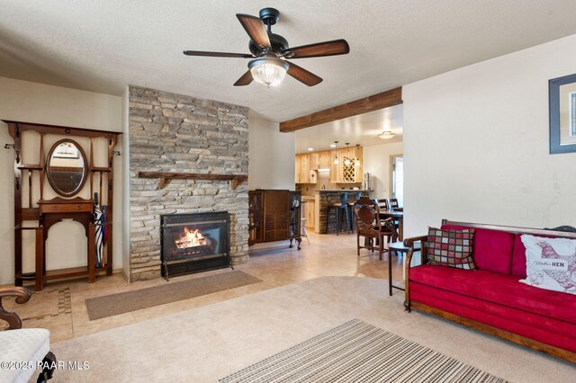 1501 W Kelly Dr, Prescott, AZ 86305 - tiled living room with a ceiling fan, a fireplace, a textured ceiling, and carpet