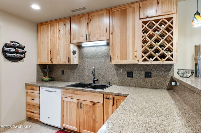 1501 W Kelly Dr, Prescott, AZ 86305 - kitchen with white dishwasher, light brown cabinets, backsplash, light countertops, and recessed lighting
