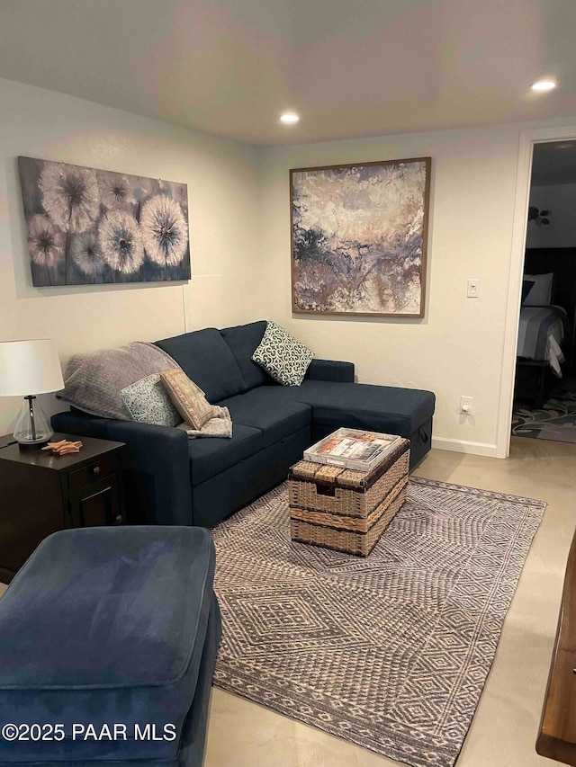 living area with recessed lighting and baseboards