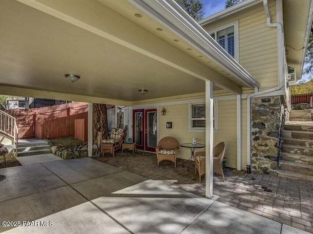 view of patio / terrace featuring fence