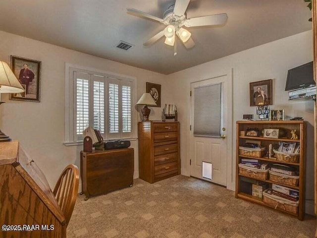 interior space featuring visible vents and a ceiling fan