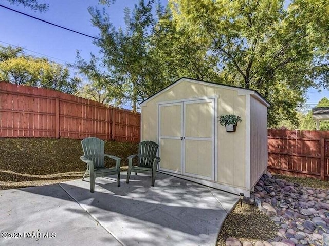 view of shed with a fenced backyard