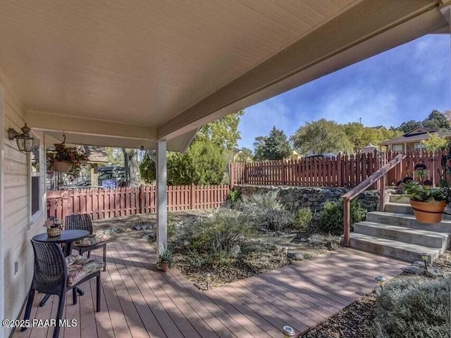 wooden deck featuring fence