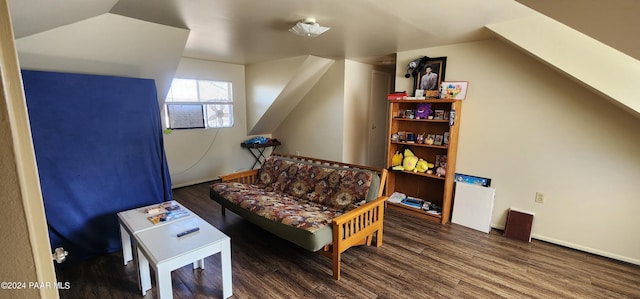sitting room featuring dark hardwood / wood-style floors and vaulted ceiling