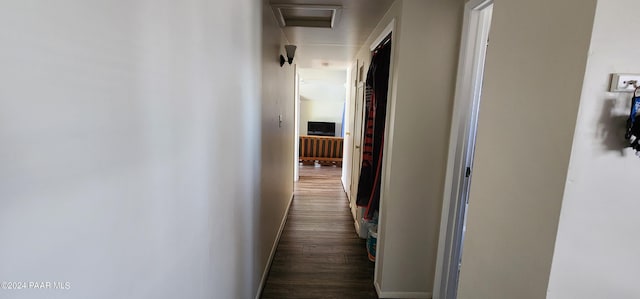 hall with dark hardwood / wood-style flooring