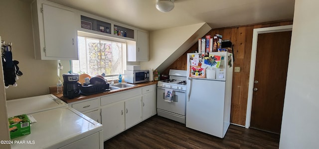 kitchen with white cabinetry, white appliances, dark wood-type flooring, and washing machine and clothes dryer