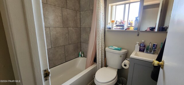 full bathroom with vanity, shower / tub combo, and toilet