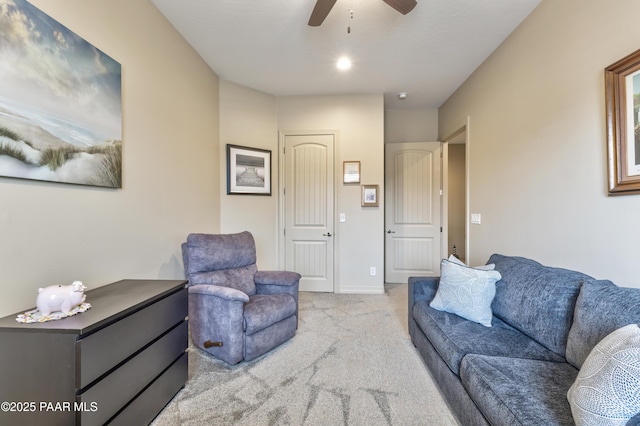 living room featuring ceiling fan and light carpet