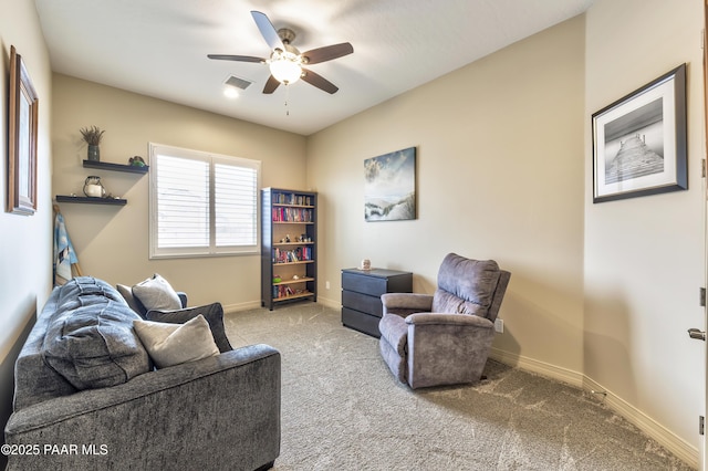 living area with a ceiling fan, carpet floors, baseboards, and visible vents