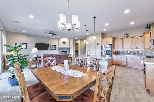 dining room featuring visible vents, recessed lighting, and ceiling fan with notable chandelier