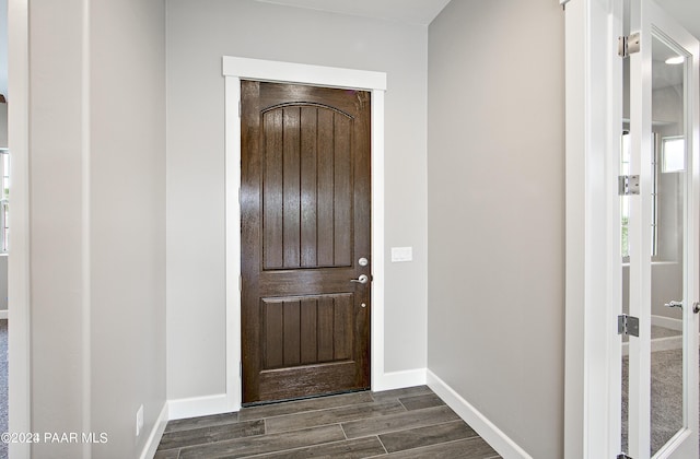 entrance foyer with dark hardwood / wood-style flooring