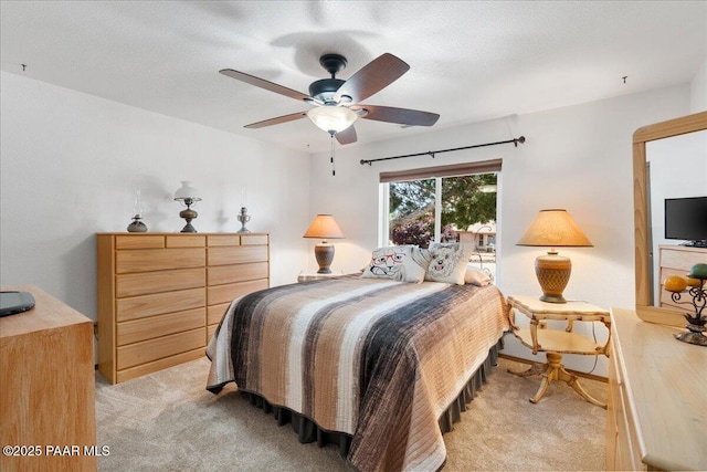4860 N Treasure Cir, Prescott Valley, AZ 86314 - bedroom with light colored carpet and a ceiling fan