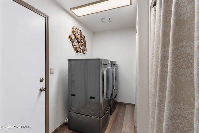 4860 N Treasure Cir, Prescott Valley, AZ 86314 - washroom featuring washer and dryer and wood finished floors