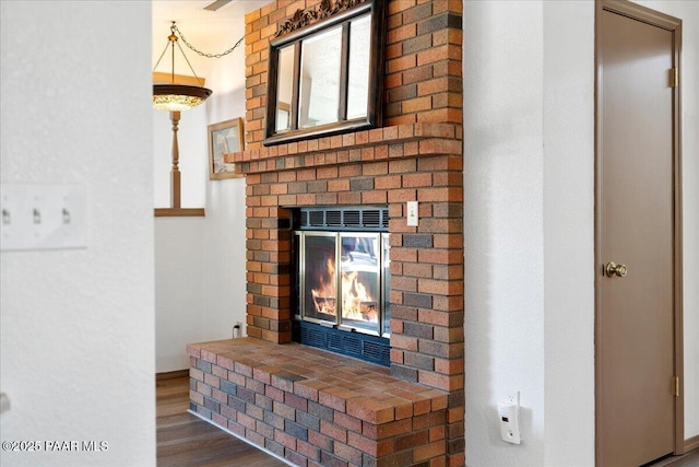4860 N Treasure Cir, Prescott Valley, AZ 86314 - detailed view of wood finished floors and a fireplace