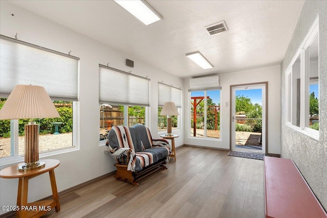 4860 N Treasure Cir, Prescott Valley, AZ 86314 - sunroom with a wall mounted air conditioner and wood finished floors