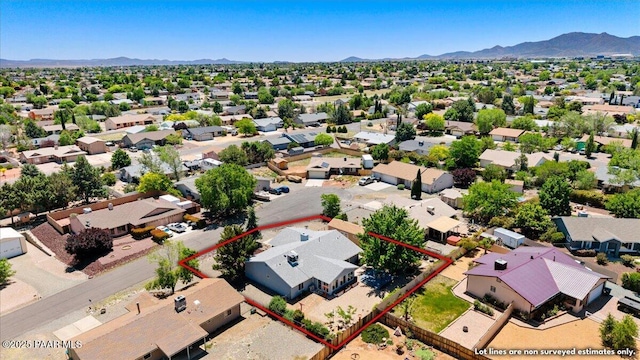 4860 N Treasure Cir, Prescott Valley, AZ 86314 - aerial perspective of suburban area featuring property boundaries highlighted and a mountainous background