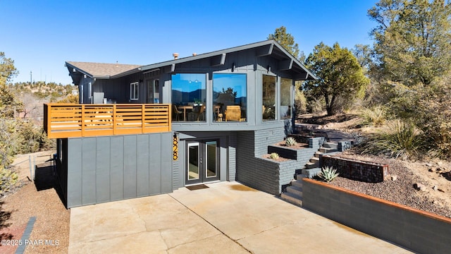 contemporary home featuring french doors and a patio