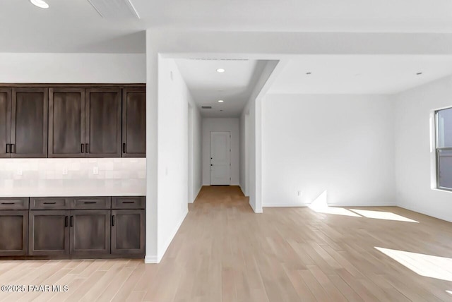 hallway with light hardwood / wood-style flooring