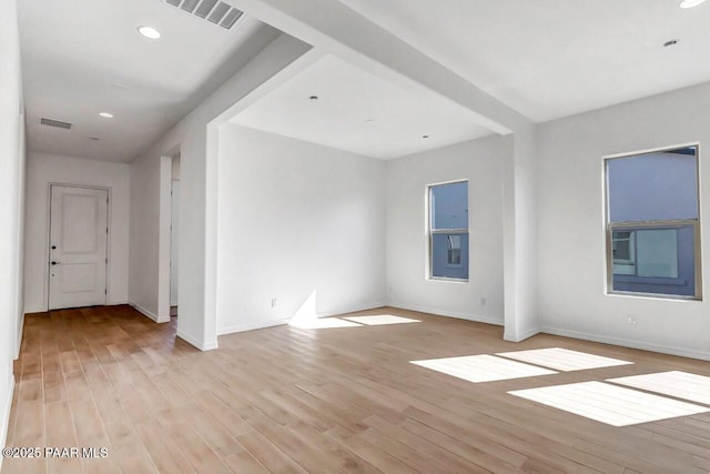 spare room with light hardwood / wood-style flooring