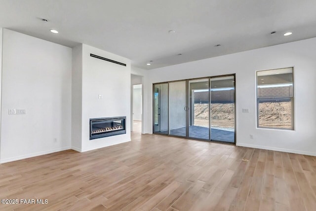 unfurnished living room featuring light wood-type flooring