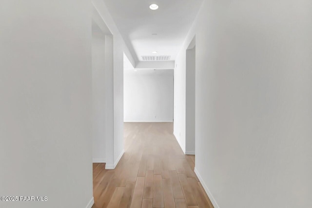 corridor featuring light hardwood / wood-style flooring