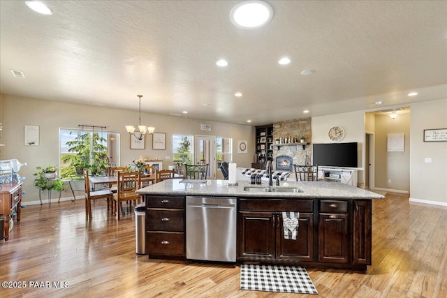 2360 W Bridle Path Rd, Prescott, AZ 86305 - kitchen with a sink, stainless steel dishwasher, light wood-style floors, dark brown cabinetry, and recessed lighting