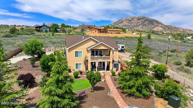 2360 W Bridle Path Rd, Prescott, AZ 86305 - view of front of house with a patio, stairway, a deck with mountain view, and a fenced backyard