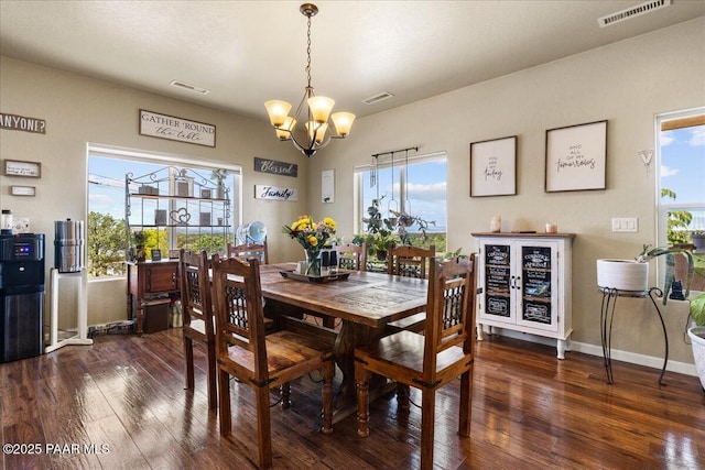2360 W Bridle Path Rd, Prescott, AZ 86305 - dining area featuring a chandelier, wood-type flooring, and baseboards