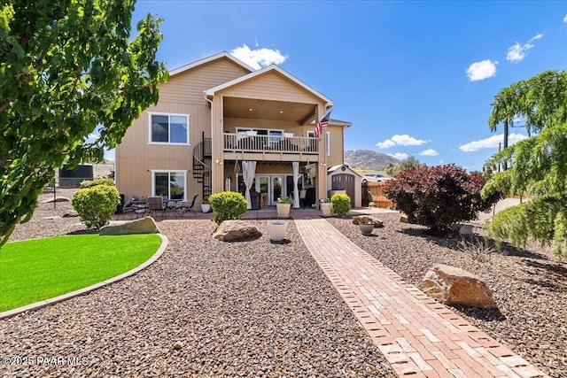 2360 W Bridle Path Rd, Prescott, AZ 86305 - rear view of house featuring stairway, a patio area, fence, a balcony, and a storage unit