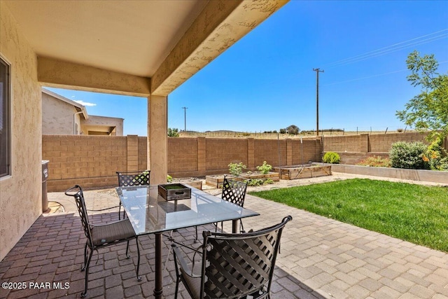 5510 N Foster Pl, Prescott Valley, AZ 86314 - fenced backyard featuring a patio, outdoor dining space, and a garden