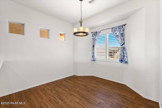 5510 N Foster Pl, Prescott Valley, AZ 86314 - spare room featuring wood finished floors and a chandelier