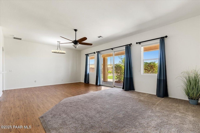 5510 N Foster Pl, Prescott Valley, AZ 86314 - empty room featuring healthy amount of natural light, a ceiling fan, and wood finished floors