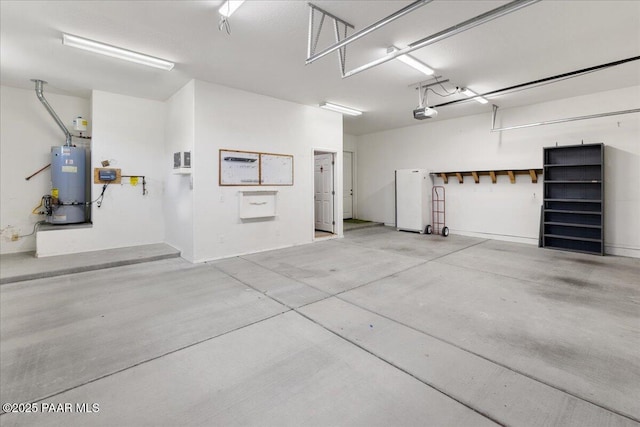 5510 N Foster Pl, Prescott Valley, AZ 86314 - garage with gas water heater and a garage door opener