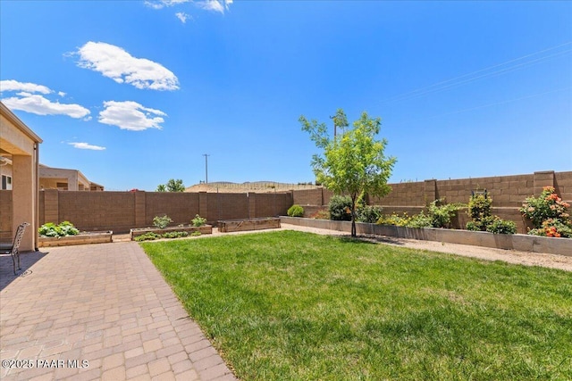 5510 N Foster Pl, Prescott Valley, AZ 86314 - fenced backyard featuring a vegetable garden and a patio