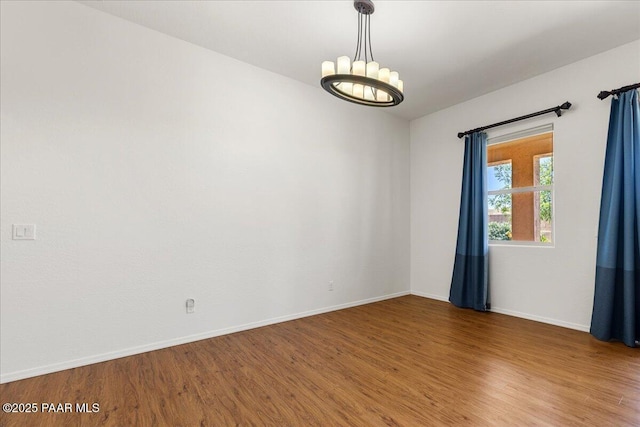 5510 N Foster Pl, Prescott Valley, AZ 86314 - spare room with wood finished floors and a chandelier