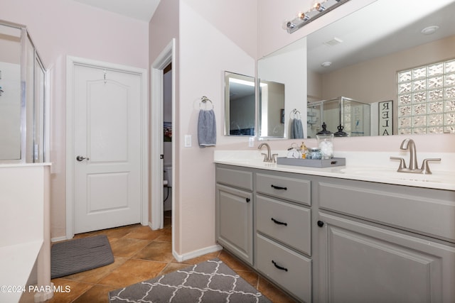 bathroom with vanity and walk in shower