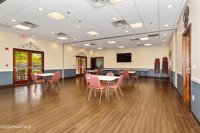 dining space featuring a paneled ceiling, french doors, and dark hardwood / wood-style floors