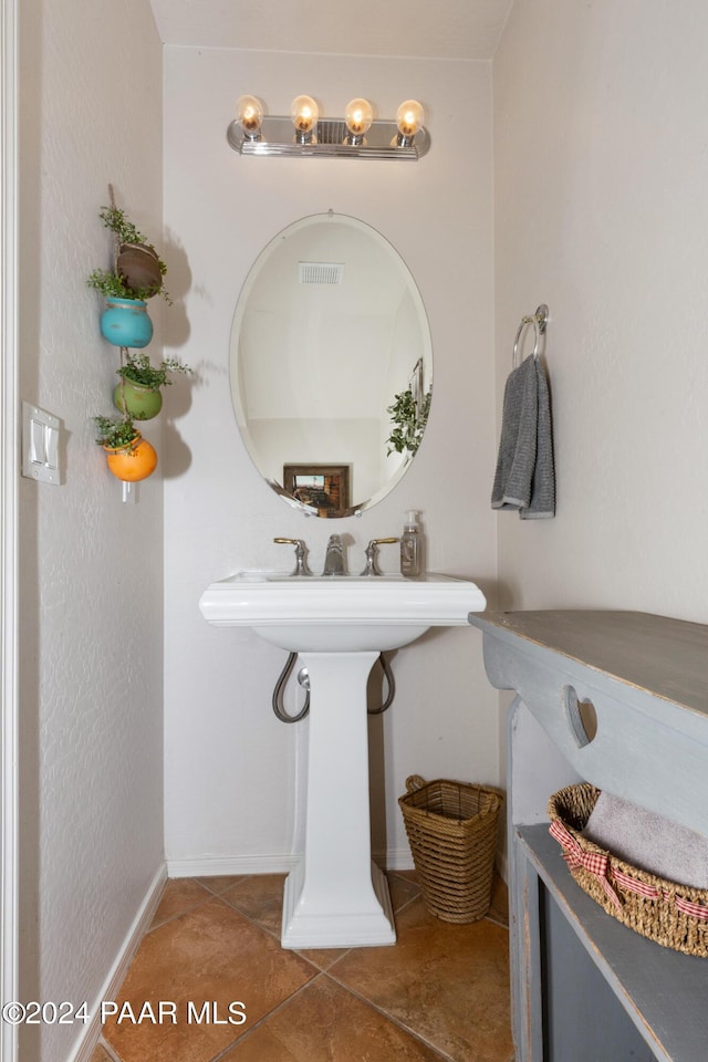 bathroom with tile patterned floors