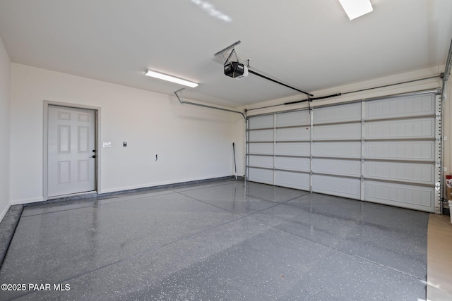 13555 E Soleil Down Rd, Mayer, AZ 86333 - garage with a garage door opener and baseboards